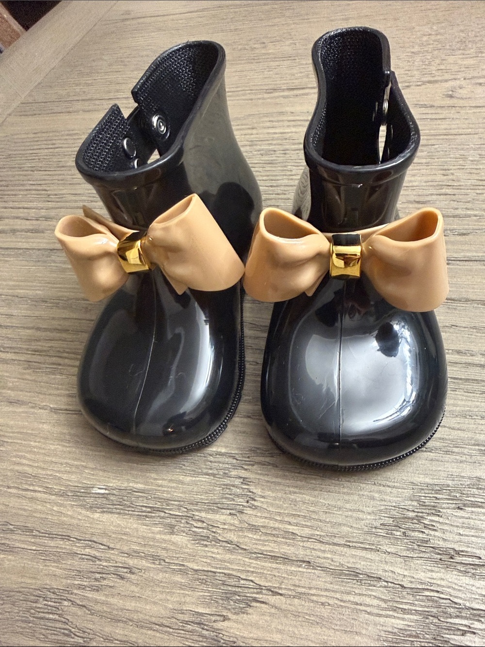 Girls' Black Gloss Rain Boots with Tan Bow Accent and Gold Detail